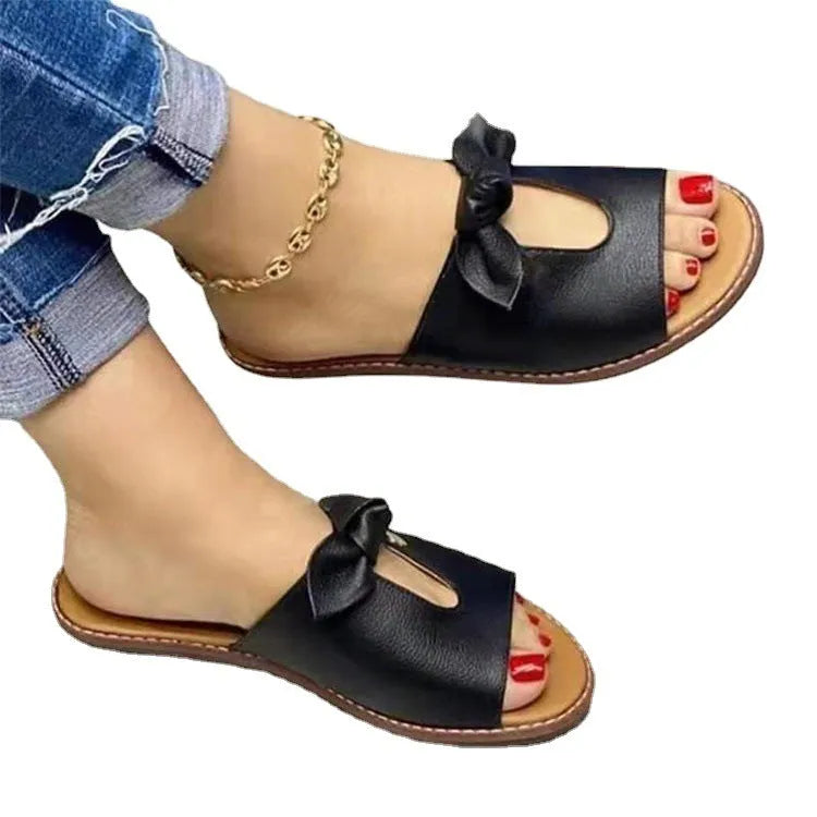 Ladies sandals with bow detail and fish mouth design in black, pink and gold colours