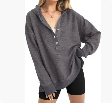 Women's loose fit peacock green raglan sleeve pullover sweater on a hanger.
