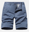 Blue denim men's shorts with printed design, loose fit, and no belt on a mannequin.