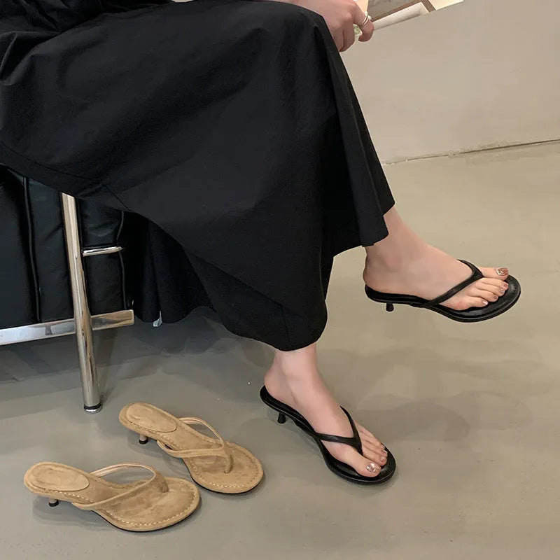 Women's black stiletto heel flip-flop sandals with round toe design