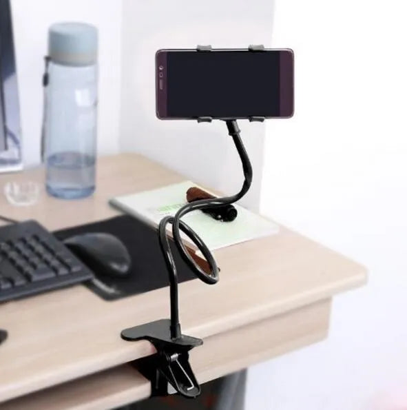Black portable phone holder with a long 70cm flexible arm and a V-shaped clip mounted on a bed frame.