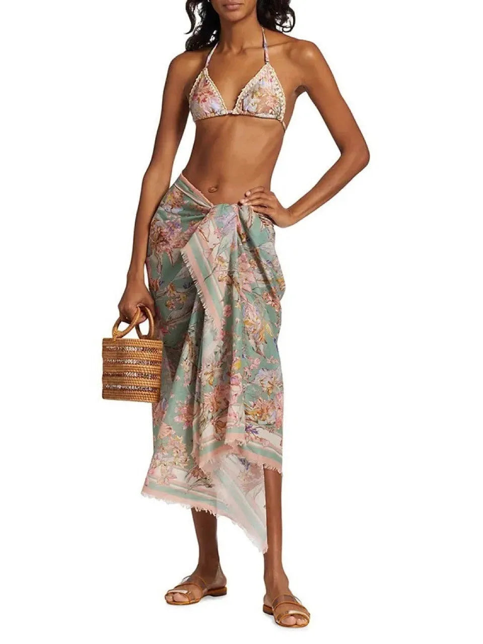 Women's creamy-white floral bikini swimsuit set with skirt, top, and briefs in nylon fabric