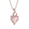 Rose gold heart-shaped pendant necklace with a pink synthetic crystal centre on a matching cross chain.
