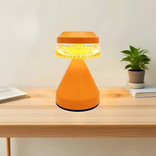 Small minimalist bedside lamp in orange with a USB cable for power.