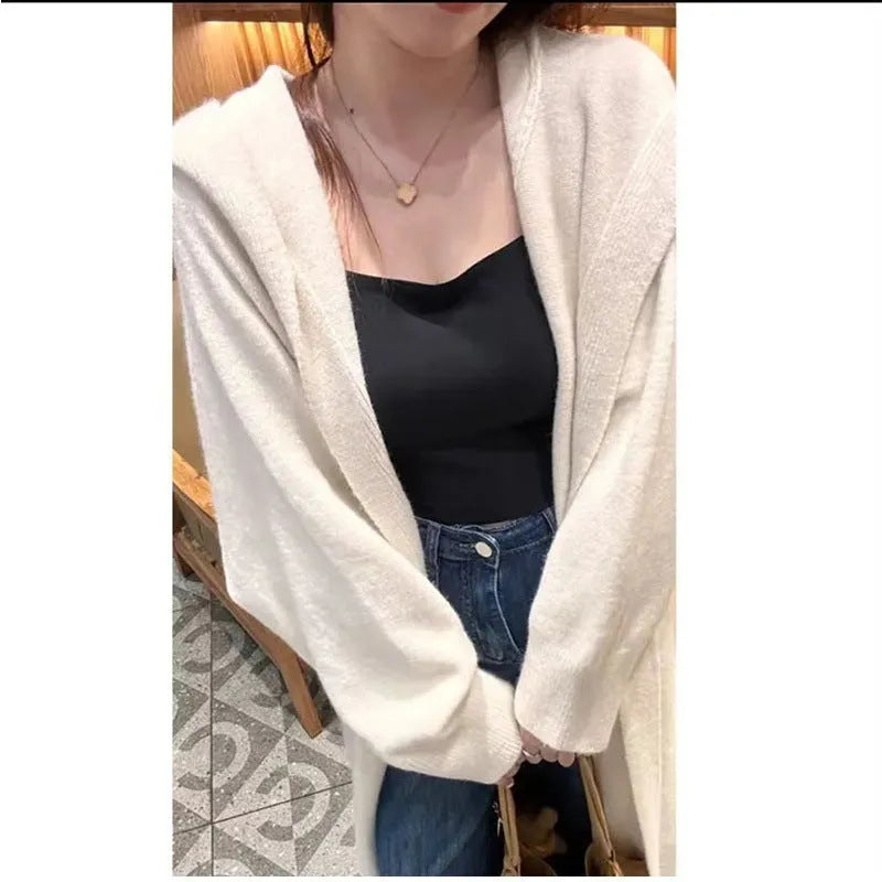 Women's long hooded cardigan in wool blend fabric showing below-the-knee length and loose fit silhouette