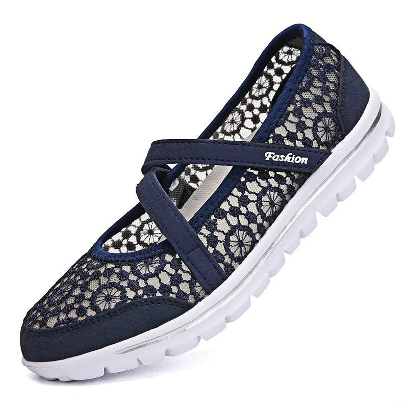 Women's flat casual shoes in beige with mesh upper and round toe, shown from the side.