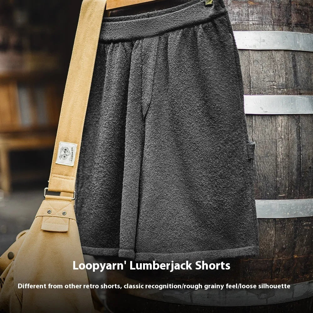 Men's cement grey straight-leg sports shorts with a loose fit, shown on a model.
