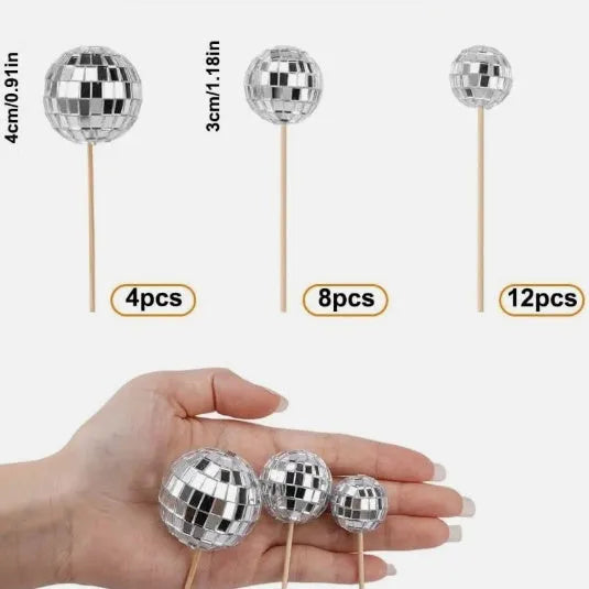 Glass disco ball cake decoration on a wooden stick, shown in different sizes for birthday cakes.