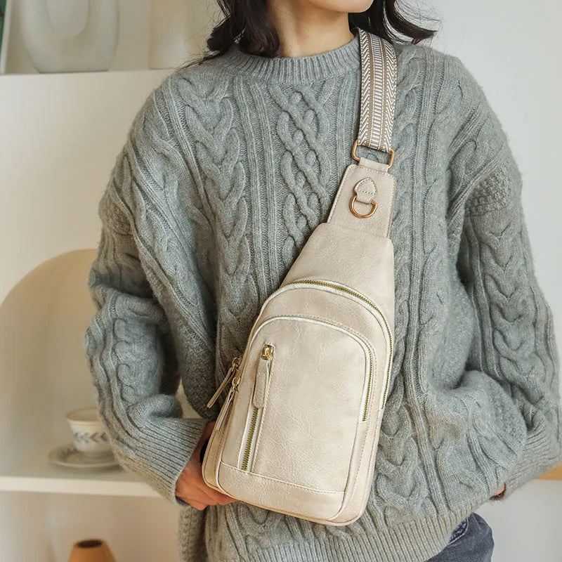 Women's soft PU leather crossbody bag in street trend style with open pocket and internal compartments