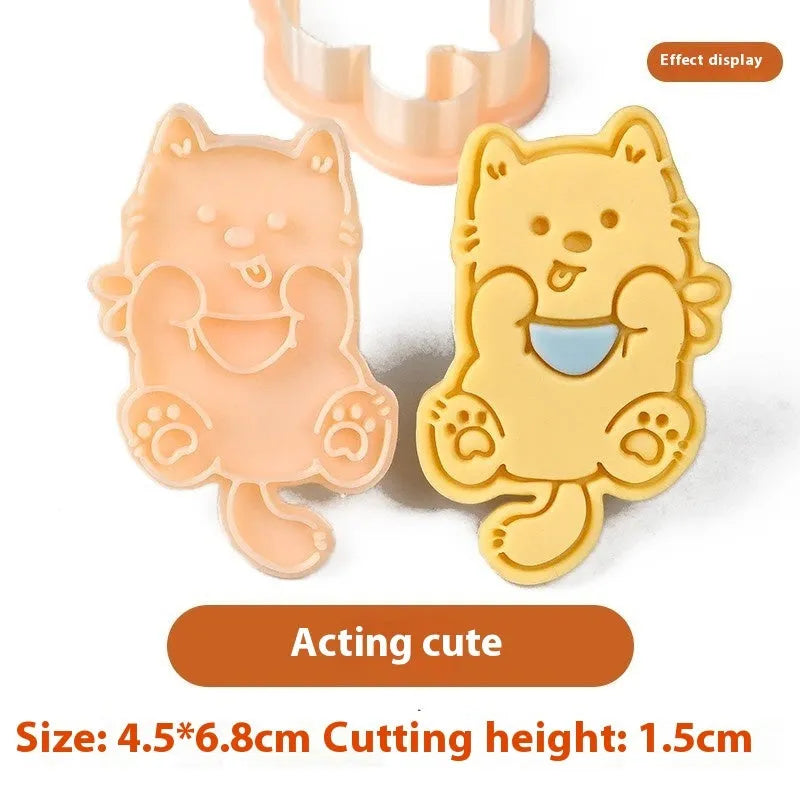 Three dimensional plastic biscuit mould showing puppy cartoon designs including birthday hats and swimming rings