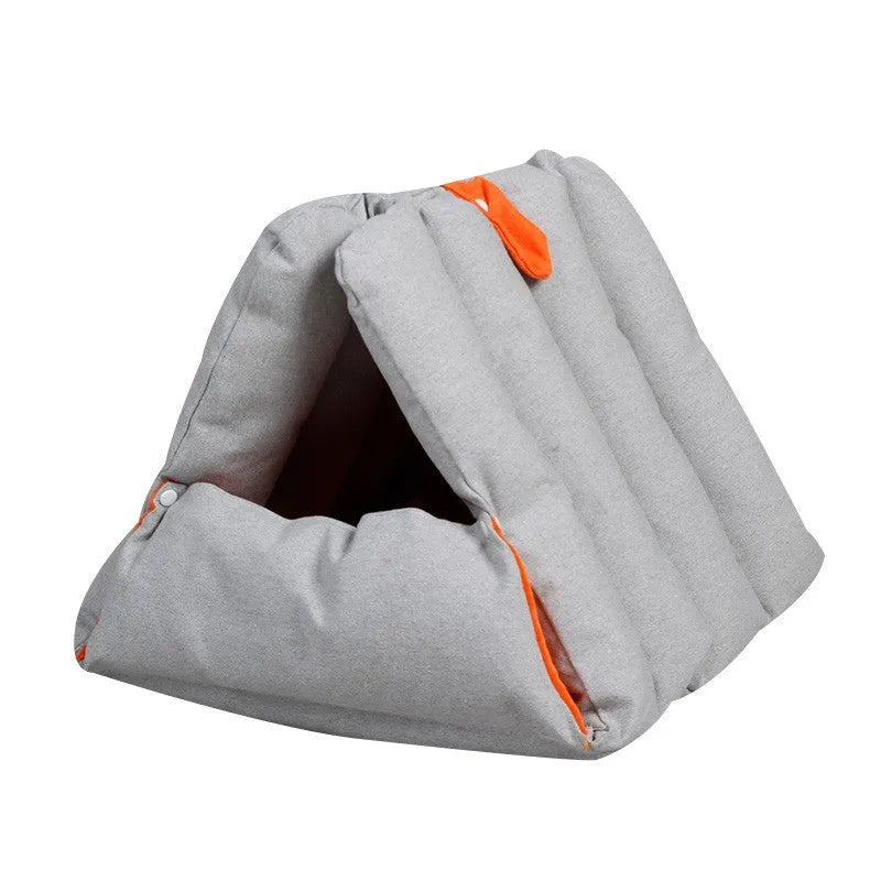 Blue triangular cat bed with drilled holes on the sides for combination, showing removable cotton cover.