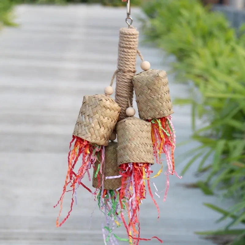 Colourful shredded paper bird toy with wood pieces and sisal fibres for parrots