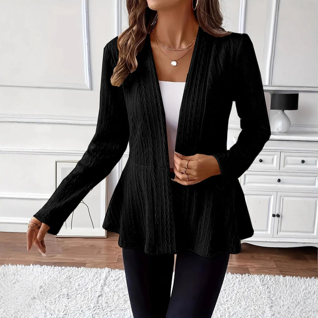 Women's apricot coloured knitted cardigan with jacquard pattern and one button, shown on a model.
