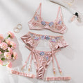 Light purple satin lingerie four-piece set with white embroidery detailing on a mannequin