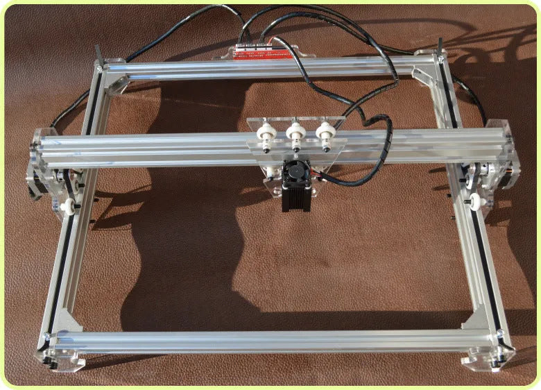 Miniature laser engraving machine with 3000mW output and 400x300mm base dimensions