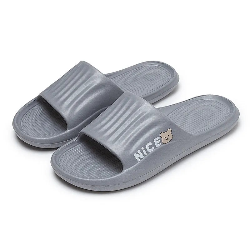 Pair of minimalist EVA flip flop slippers in a choice of six colours, showing the injection moulded non-slip sole.