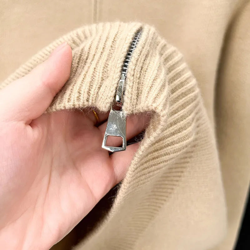 Men's loose grey knitted cardigan with a stand collar and a front zipper.