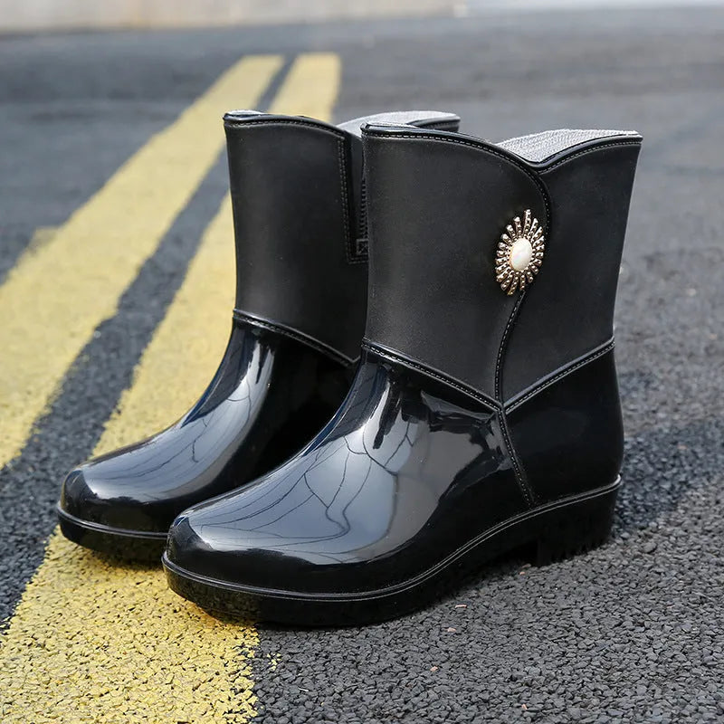 Women's purple PVC rain boots with non-slip sole and middle tube design