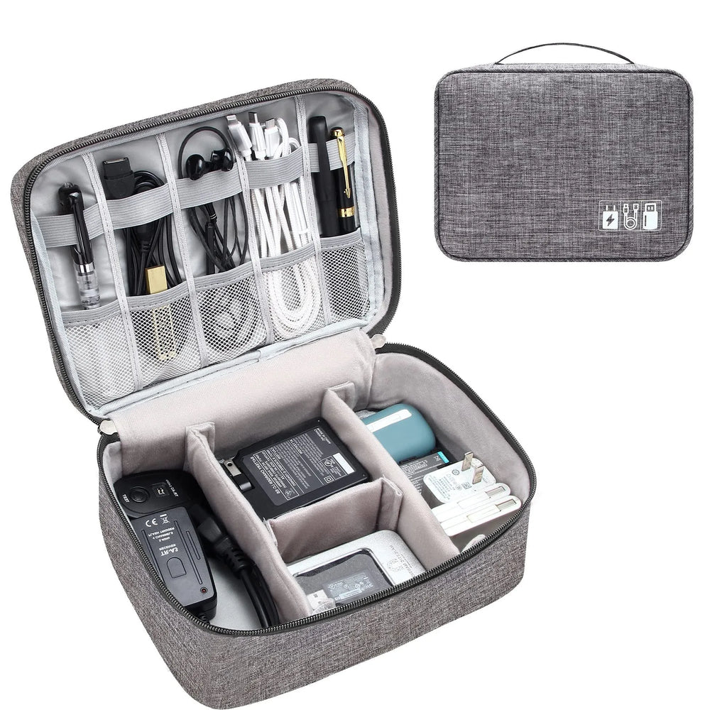 Black waterproof travel cable organiser bag open to show removable dividers and mesh pockets for electronics.