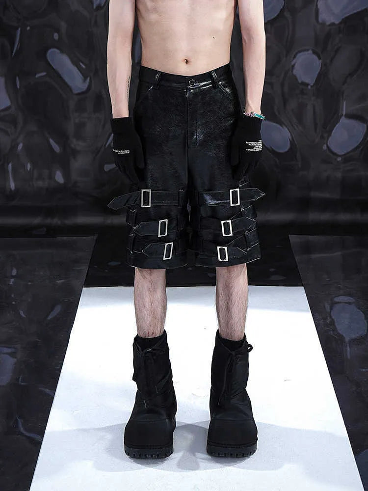 Black men's PU leather casual cropped shorts with a medium-low waist on a mannequin.