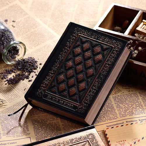 A5 embossed faux leather notebook with a thick cover in bronze or black gold colour.