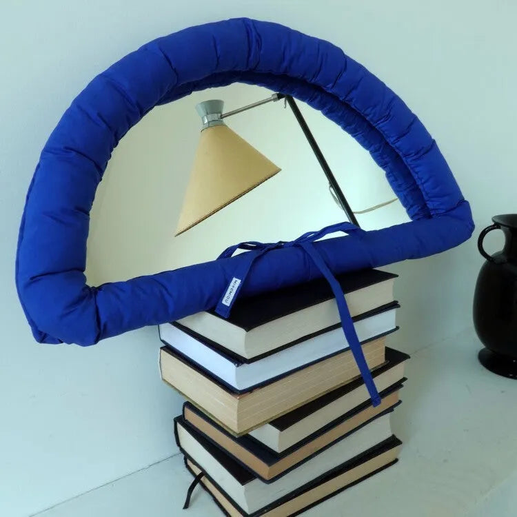 Hanging cotton-filled fabric mirror in white, black or sapphire blue measuring 23x40x5cm