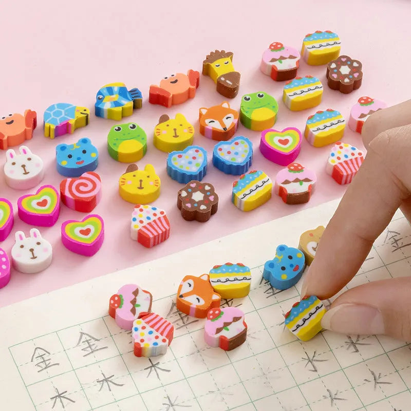 Assortment of 50 colourful cartoon mini erasers including fruits, animals, and themed shapes on a white background.
