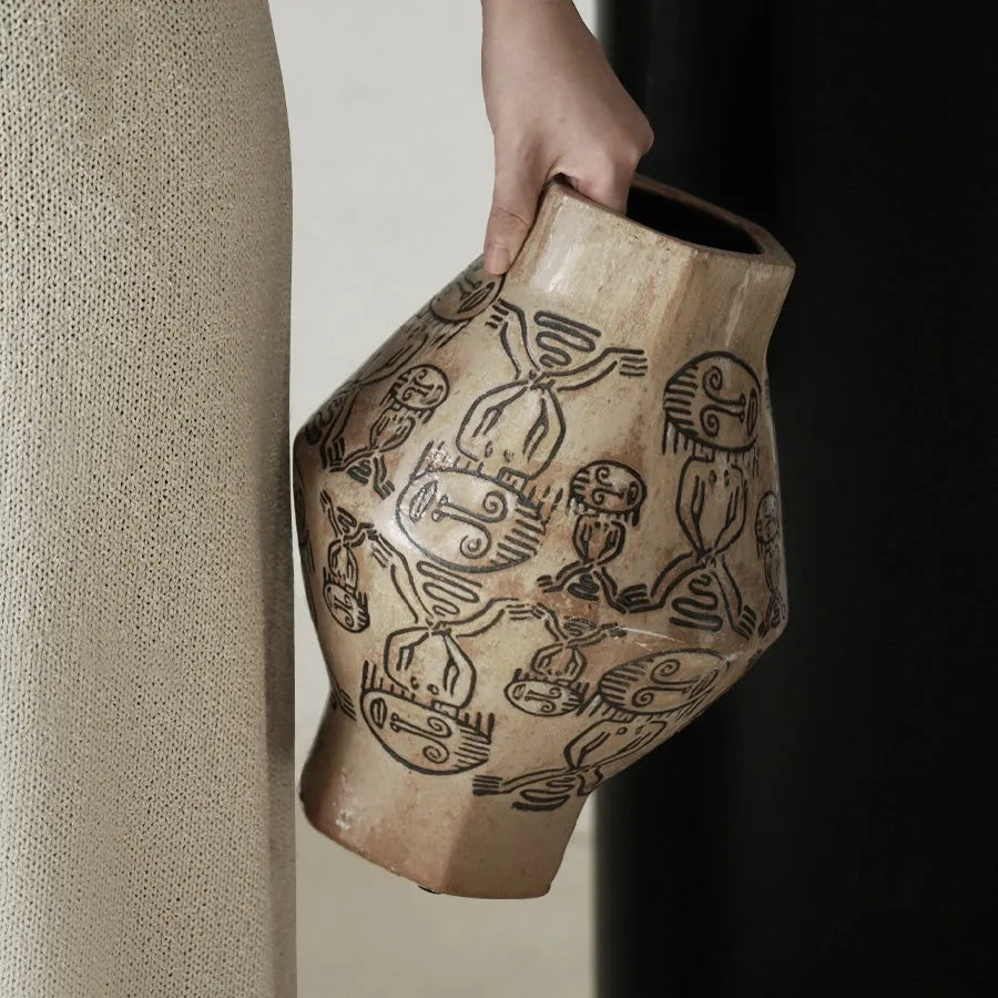 Hand-painted ceramic vase with carved tribal totem flower pattern in cylindrical shape