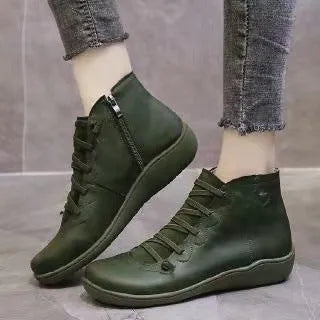 Women's flat casual booties with wedge heel and round toe in multiple colour options.