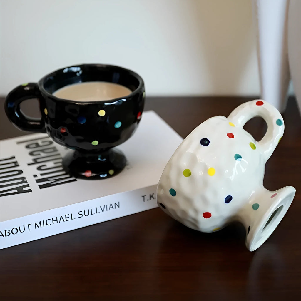 Hand-pinched irregular ceramic mug in a solid colour, showing unique handmade shape.