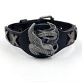 Black geometric leather bracelet with a large alloy eagle watch clasp closure.