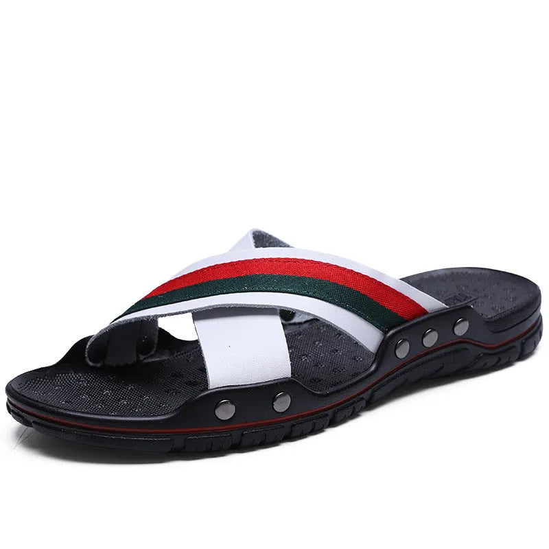 Men's cowhide leather flip-flop sandals with a non-slip PU sole in black, shown on a sandy beach.