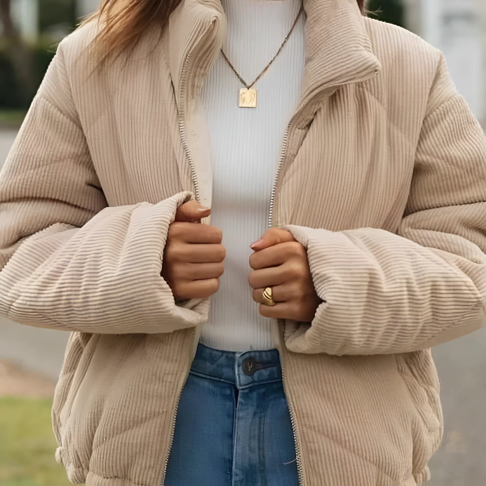 Women's apricot corduroy jacket with stand collar, long sleeves, and full-length zipper closure