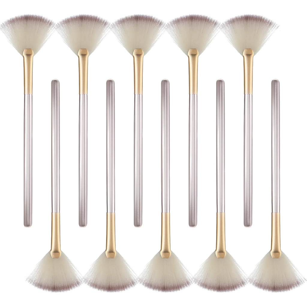 Set of 10 professional fan makeup brushes with champagne handles and protective covers.