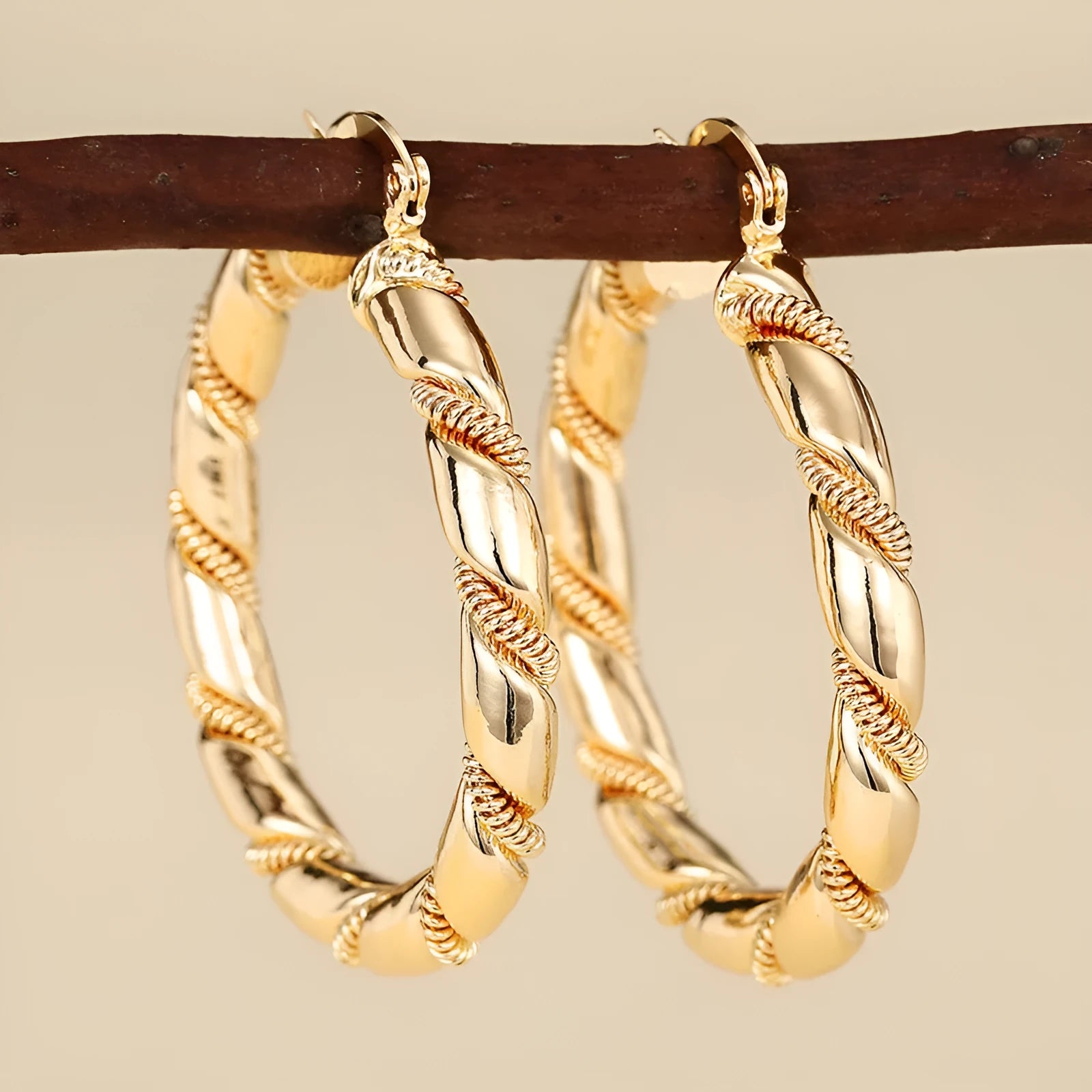 Geometric women's copper earrings with ring and line details in a gold colour.