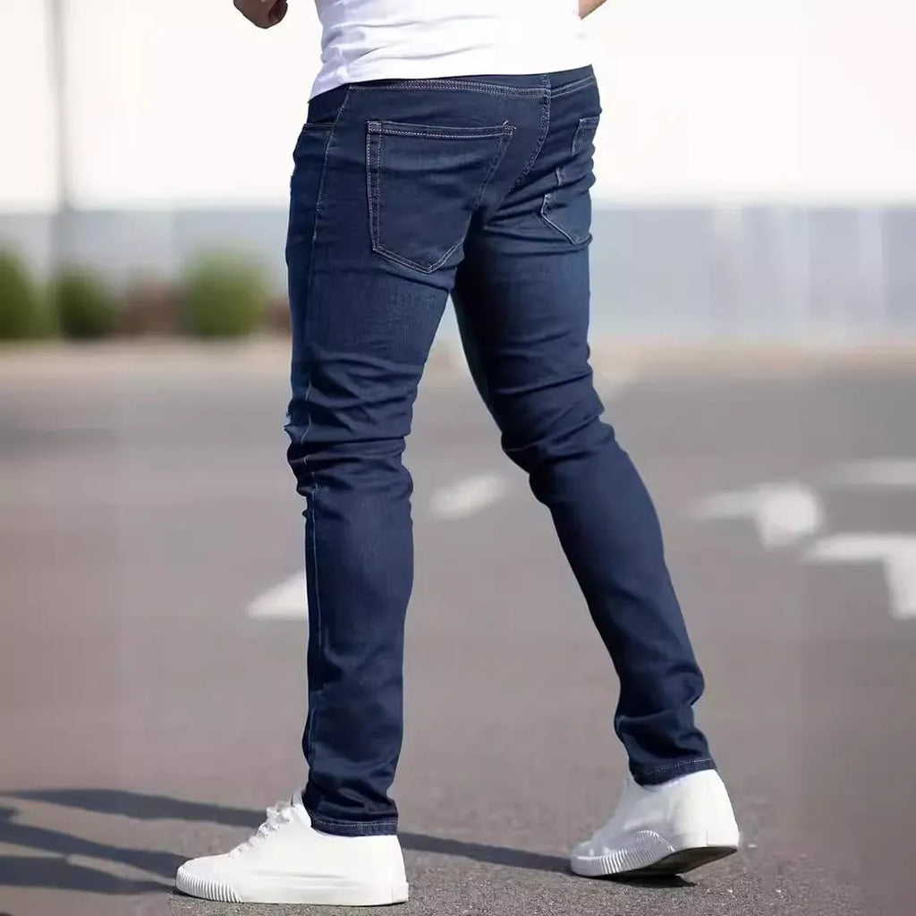 Men's dark blue slim casual jeans with medium elastic waist and skinny leg style