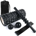 Black foam massage roller stick with six textured sections measuring 33cm long