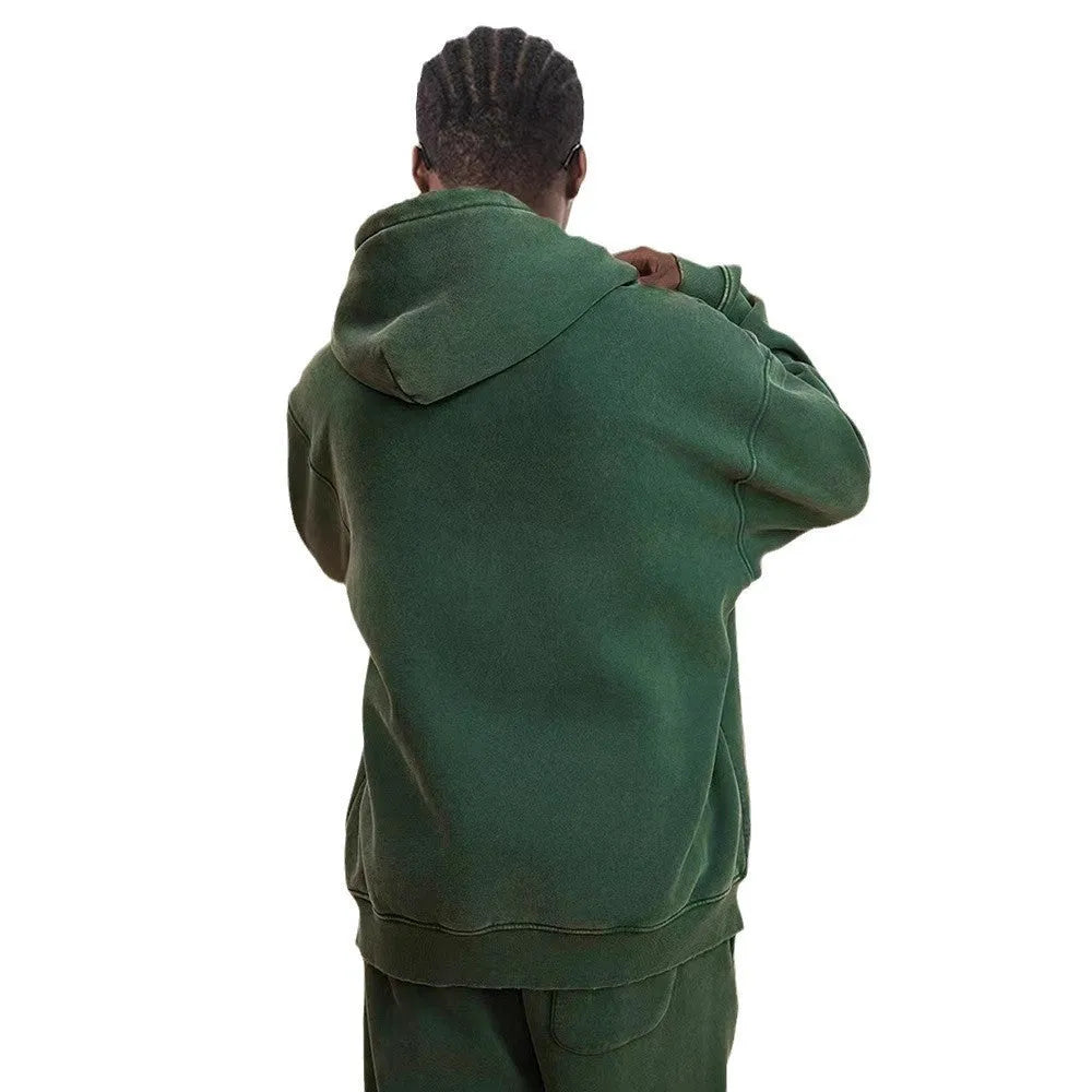 Man's dark green fleece-lined hooded cardigan sweater with a double zip front.
