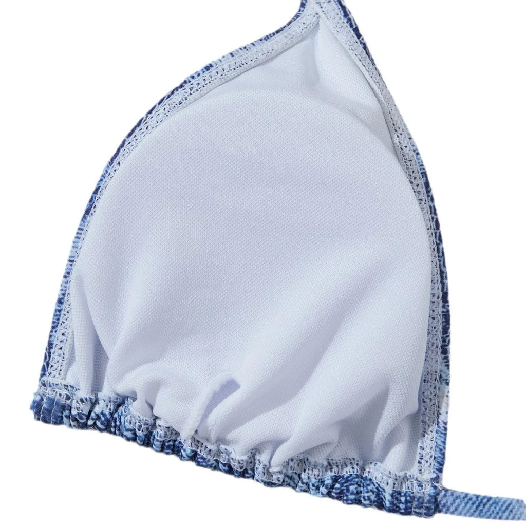 Women's denim blue printed bikini set with adjustable straps on mannequin