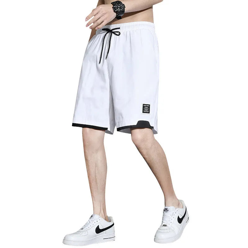 Boys' cotton summer shorts in sporty style available in black, khaki, and white colours