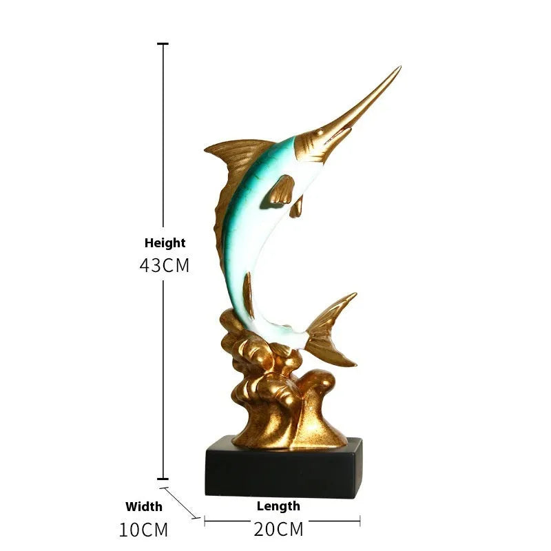 Close-up of a detailed resin European swordfish ornament in bright gold colour on a shelf.