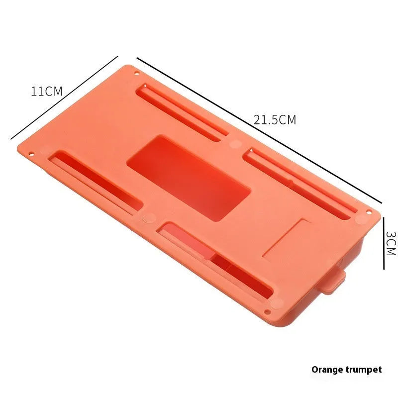 Adhesive under table storage drawer in plastic with covered grid design, shown in grey colour