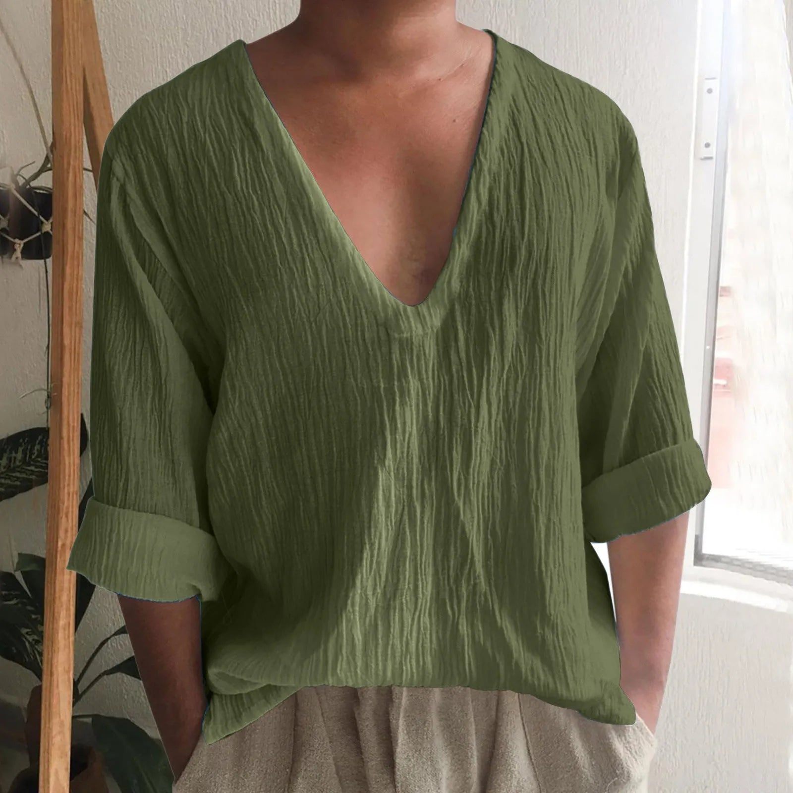 Men's washed cotton long sleeve V-neck t-shirt in solid colours on a hanger.