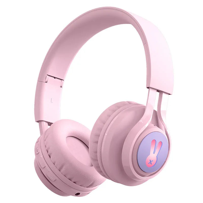 Wireless RGB LED headphones for children in bunny pink with lights illuminated
