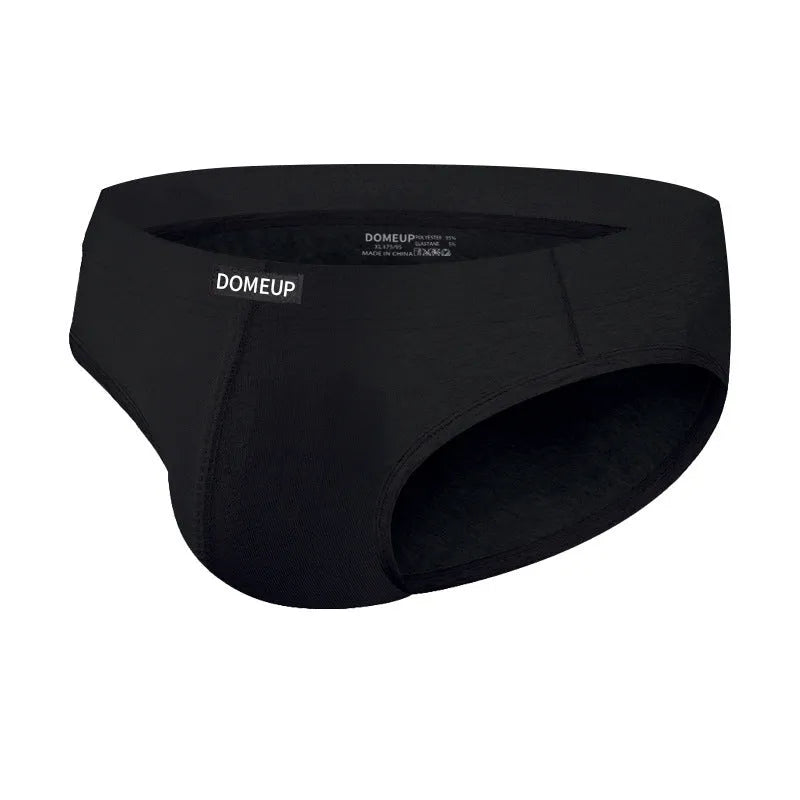 Men's solid colour seamless low-waist briefs in white, black, and pink laid flat.