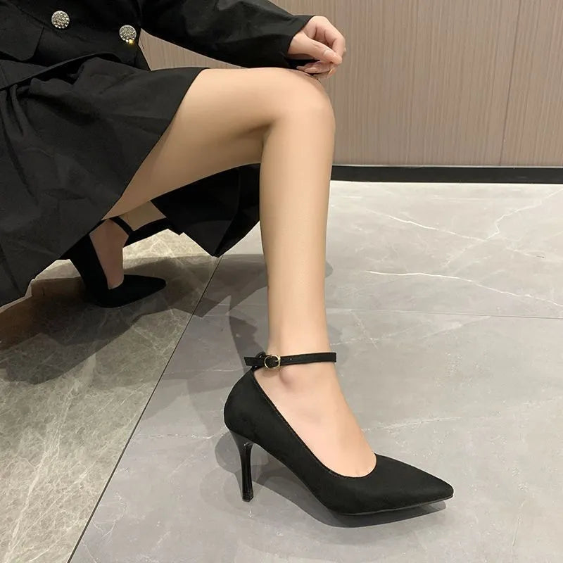 Women's black stiletto pump shoes with skull pattern and buckle detail on 8cm heel