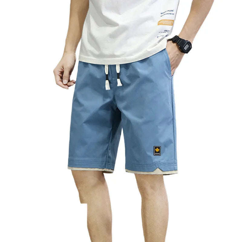 Men's loose fit straight leg beach shorts in various colours with elastic waistband
