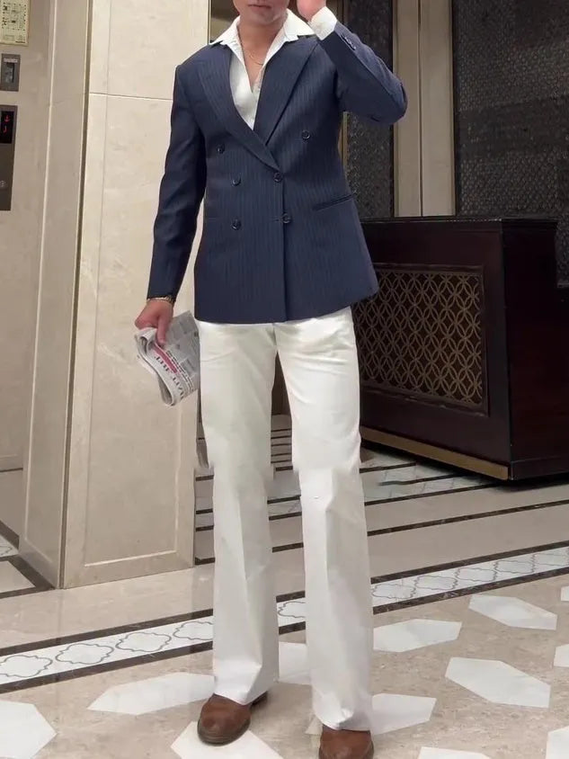 Men's classic stripe double breasted blazer on a hanger, showing regular fit and length.