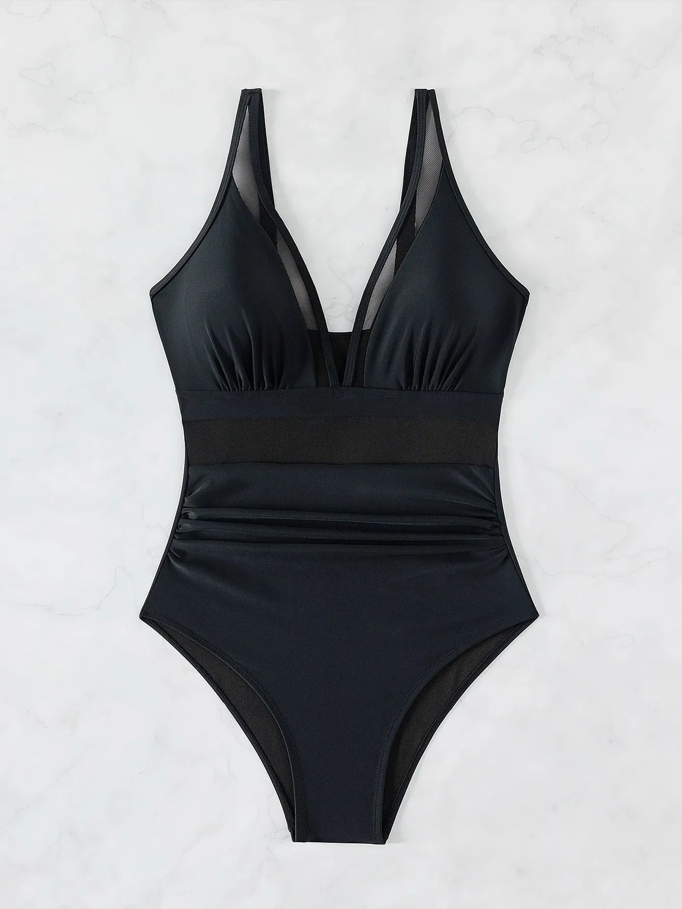 Black halter neck one-piece swimsuit with mesh detailing on adult female model