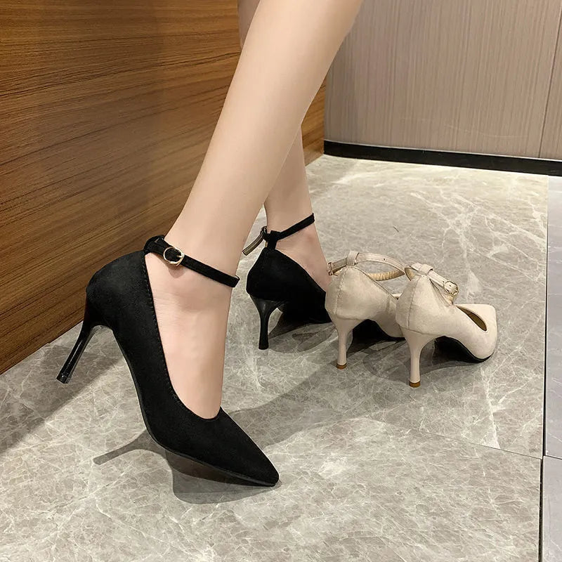Women's black stiletto pump shoes with skull pattern and buckle detail on 8cm heel